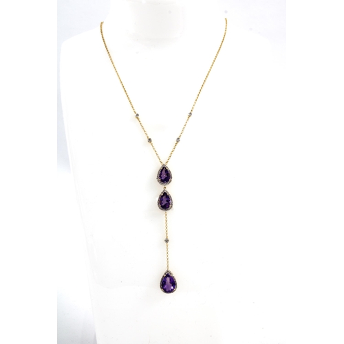 49 - 18ct gold amethyst and diamond pendant necklace, set with three pear shaped amethysts within a borde... 