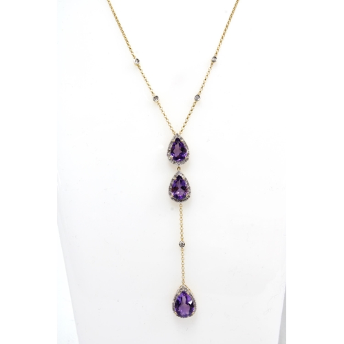 49 - 18ct gold amethyst and diamond pendant necklace, set with three pear shaped amethysts within a borde... 