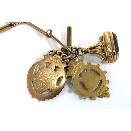 58 - Watch chain, clasp stamped 9ct with an unmarked T-bar, a 9ct gold swivel fob and two 9ct gold medals... 