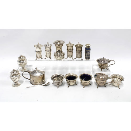 69 - A collection of silver condiments to include salts, peppers and mustards, mixed makes and hallmarks ... 