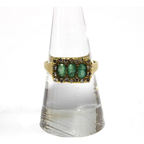 79 - 18ct gold diamond and emerald ring, London 1982