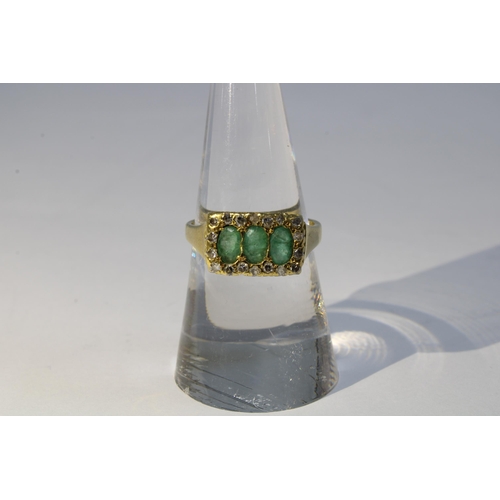 79 - 18ct gold diamond and emerald ring, London 1982