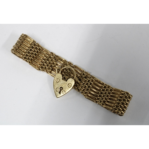 82 - 9ct gold gate link bracelet with heart shaped padlock, Sheffield 1978