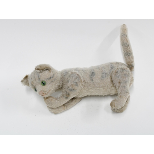 368 - Early 20th century automaton striped cat with wagging tail and moving head, perhaps by Schuco, 31cm ... 