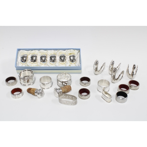 419 - A collection of silver plated and Epns  napkin rings and wine bibs, (a lot)