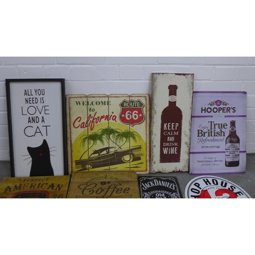 435 - A quantity of wooden and tin wall plaques to include 'All you need is love and a cat' and 'Founder m... 