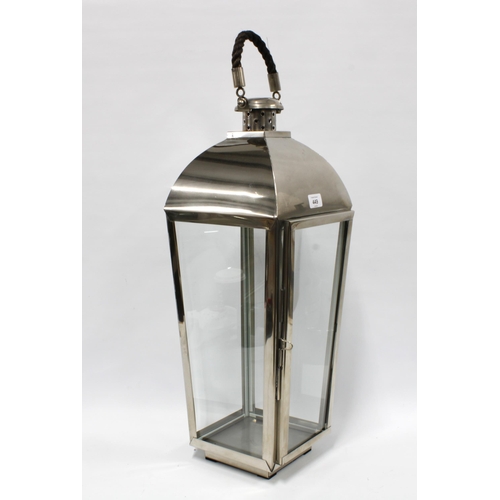 449 - Large brushed metal storm light / candle lantern, with glazed panels, rope handle, 63cm