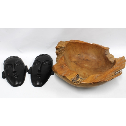 454 - Driftwood style bowl, 53cm diameter, and a pair of pottery wall masks, (3)