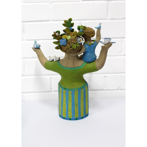 110 - BIDDY PICARD (1922-2019) Stoneware figure of a woman with flowers in her hair and a child sat upon h... 