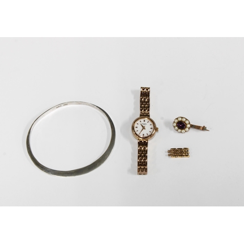 102 - ROTARY, a ladies gold plated wrist watch together with a silver bangle and a seed pearl brooch (3)