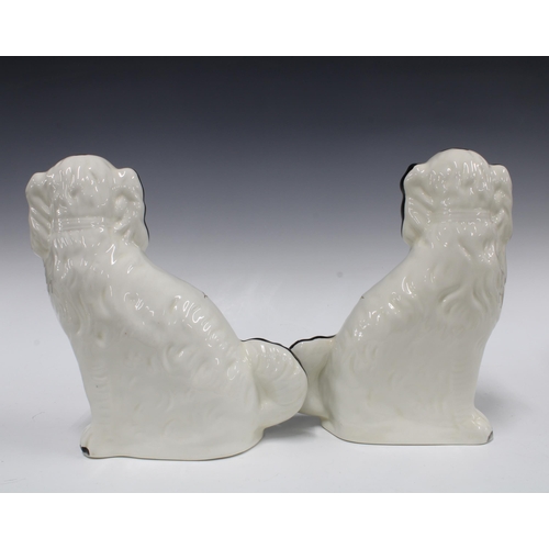 160 - Pasir of black and white pottery chimney spaniels by Wood (2) 28cm