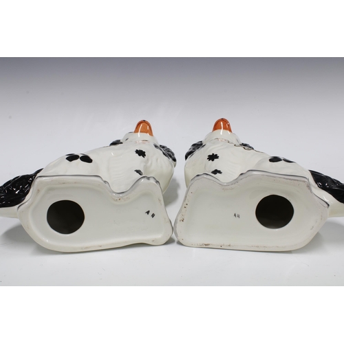 160 - Pasir of black and white pottery chimney spaniels by Wood (2) 28cm