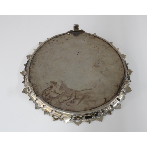 21 - Portuguese salver with pierced acanthus rim and engraved central pattern, standing on  three paw fee... 