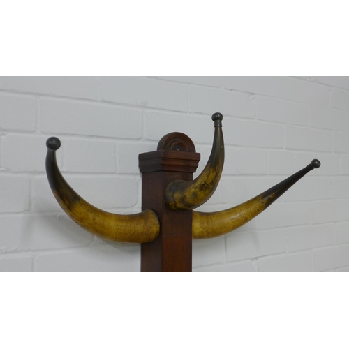 267 - Late 19th / early 20th century cow horn hat and coat stand, 64 x 190cm.