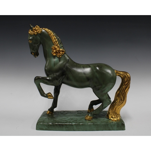 364 - Green and gilt glazed horse on a rectangular plinth base, (small glaze nick to tip of one ear) 42 x ... 