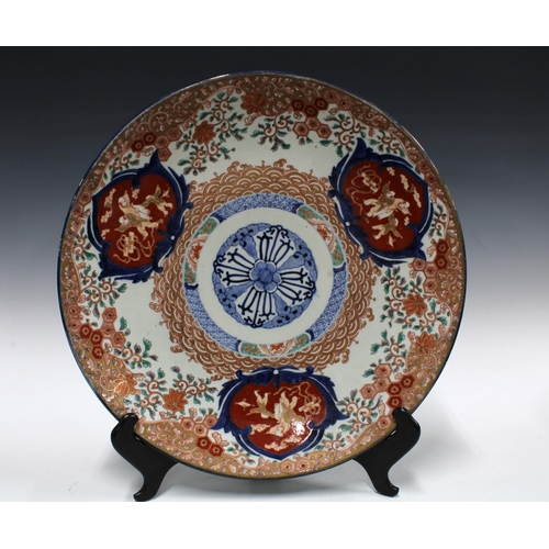 377 - Large Imari charger, typically decorated and with underglaze blue roundel to centre, 46cm diameter