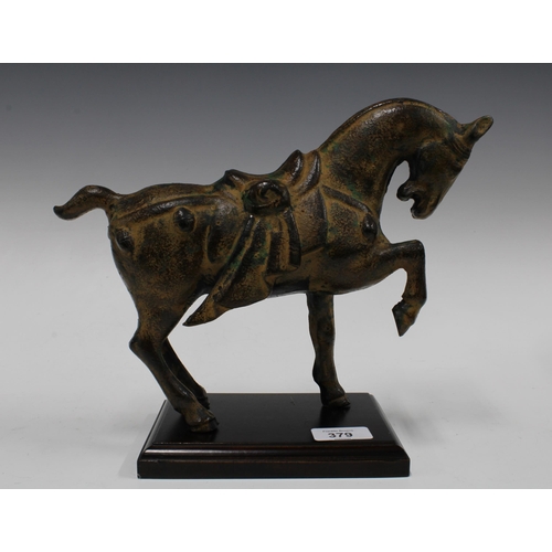 379 - Modern Tang style metal horse on wooden plinth base, 29 x 23cm