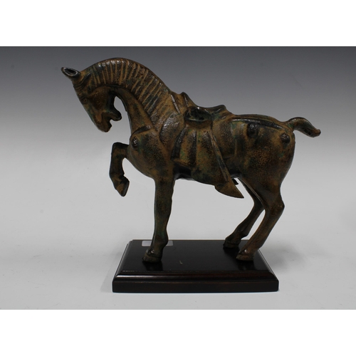 379 - Modern Tang style metal horse on wooden plinth base, 29 x 23cm