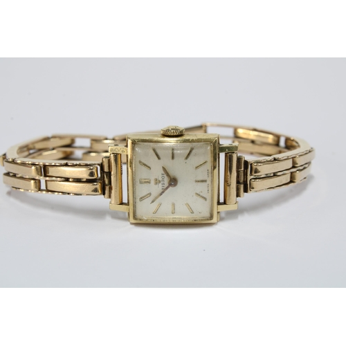 66 - TISSOT, ladies vintage 14ct gold cased wristwatch on a 9ct gold bracelet strap, stamped 375