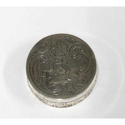 91 - Dutch silver pill box, circular form, hinged lid with an engraved pattern and with repousee side dec... 