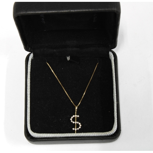 1 - 9ct gold $ pendant on a yellow metal chain