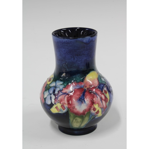 107 - Moorcroft Orchid pattern vase, blue ground with impressed factory marks, 9 x 13cm.