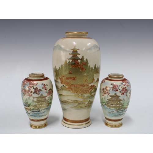 111 - A garniture of Japanese earthenware vases, with pagoda pattern and signed with character makrs, to i... 