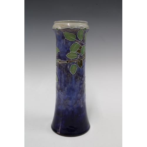 120 - Royal Doulton vase by Lily Partington, blue ground with a pink roses and foliage, , impressed marks ... 