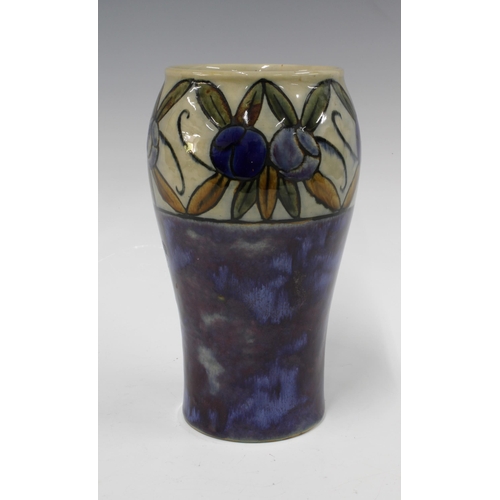 121 - Royal Doulton vase by Bessie Newberry, blue ground with a band of fruit and foliage, impressed marks... 