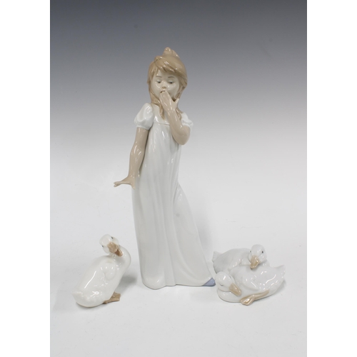 126 - Nao, Spanish porcelain figure of a girl with two Nao ducks (3) 30cm.