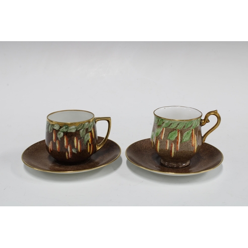 132 - An early 20th century handpainted set of  Czechoslovakia cups and saucers with a matching sugar bowl... 