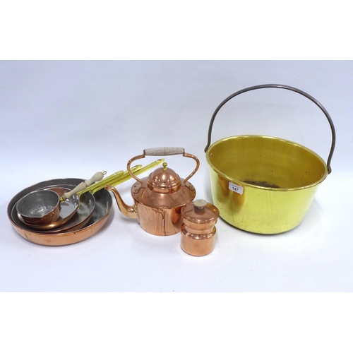 147 - A collection of copper and brass pans, a vintage brass jelly and and a small copper canister and ket... 