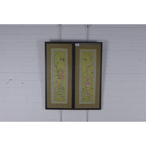 195 - A pair of Japanese silk needlework panels, framed under glass, 28 x 65cm including frames (2)