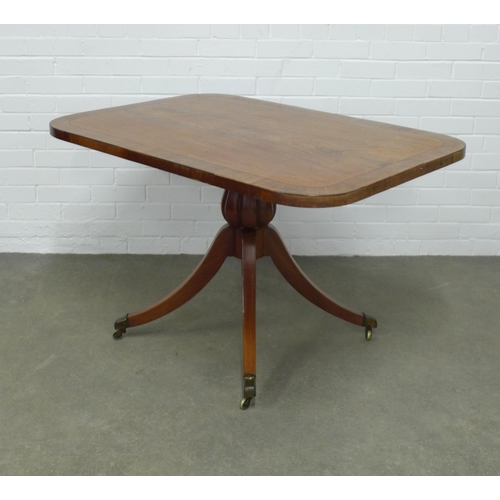 201 - Mahogany tilt top breakfast table with a cross banded top on a pedestal base with splayed legs endin... 