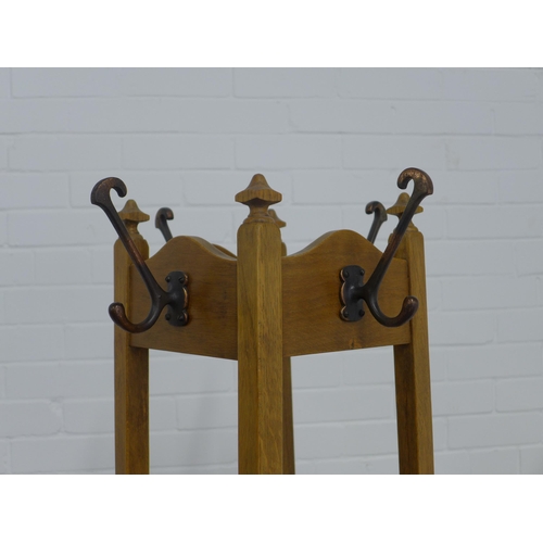 232 - An early 20th century oak hat and coat stand, freestanding with original metal hooks and drip pan,  ... 