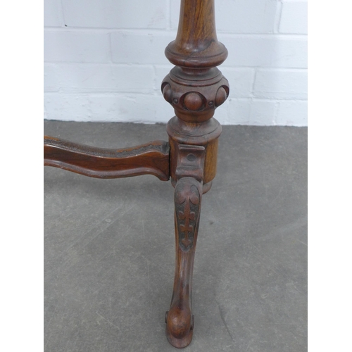 239 - Victorian mahogany table, shaped top on carved end supports with wavy stretcher, 167 x 69 x 53cm.