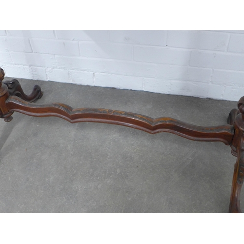 239 - Victorian mahogany table, shaped top on carved end supports with wavy stretcher, 167 x 69 x 53cm.