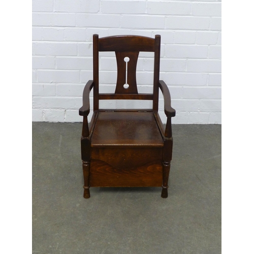 243 - An early 20th century mahogany child's commode chair, 37 x 61 x 32cm.