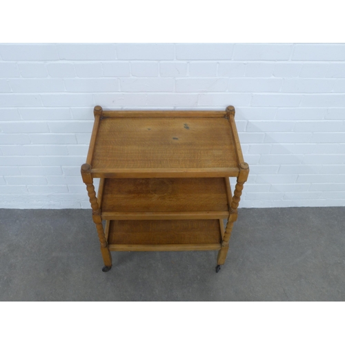 251 - An oak three tier buffet trolley with bobbin supports, , 61 x 80 x 38cm.