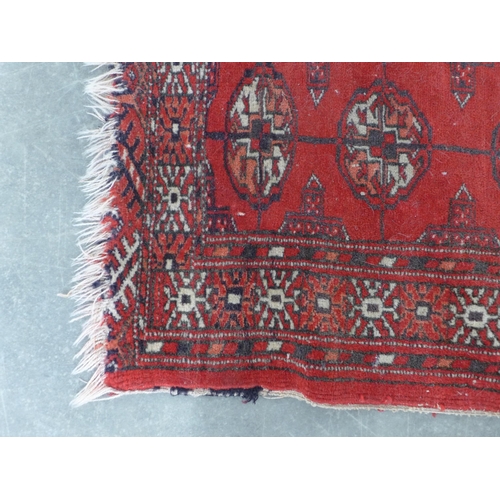 267 - Bokhara rug, red field with three rows of seven guks,  110 x 89cm.