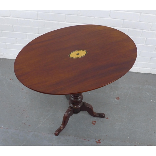 287 - Mahogany pedestal tilt top table with inlaid paterae, 74 x 72 x 51cm.