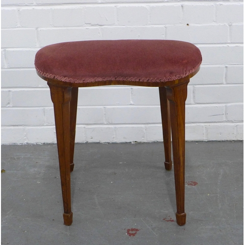 291 - Mahogany kidney shaped stool with red upholstered seat on tapering legs and spade feet, 46 x 47 x 32... 