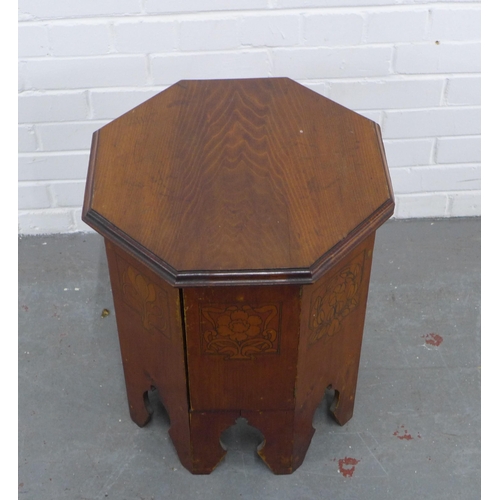 294 - Art Nouveau mahogany octagonal table with cupboard door, 45 x 53cm.