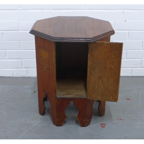 294 - Art Nouveau mahogany octagonal table with cupboard door, 45 x 53cm.