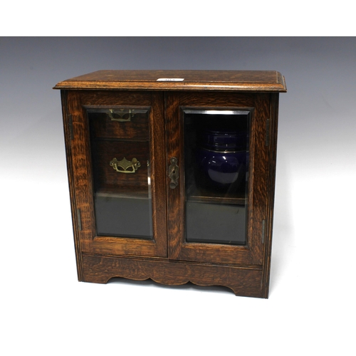 303 - Early 20th century oak smokers cabinet with pottery tobacco jar, 34 x 34cm.