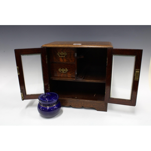 303 - Early 20th century oak smokers cabinet with pottery tobacco jar, 34 x 34cm.