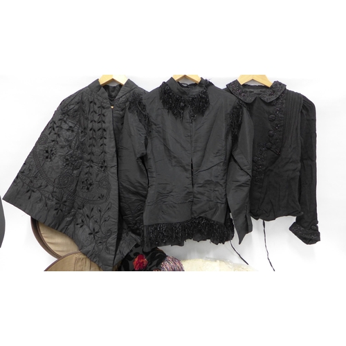 342 - Collection of late 19th / early 20th century clothing to include three black capes, a vintage hat bo... 