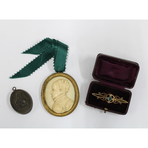 64 - Early 20th century 9ct gold brooch, black cameo pendant and a faux ivory plaque (3)