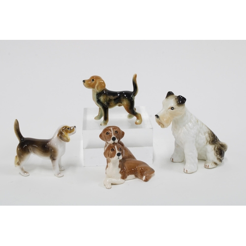 86 - Beswick group of two spaniels and four other dog figures (5) 11cm.