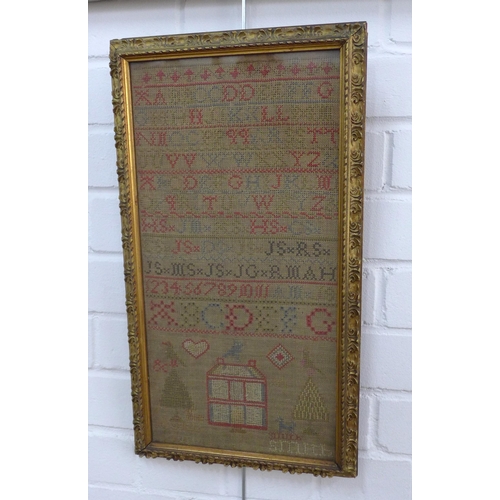 380 - Alphabet and house needlework sampler, framed under glass 22 x 43cm